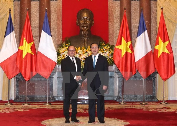 Chủ tịch nước Trần Đại Quang và Tổng thống Pháp Francois Hollande. (Ảnh: Nhan Sáng/TTXVN)