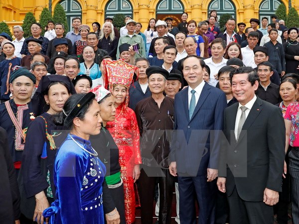 Chủ tịch nước Trần Đại Quang với các đại biểu tại buổi gặp mặt. (Ảnh: Nhan Sáng/TTXVN)