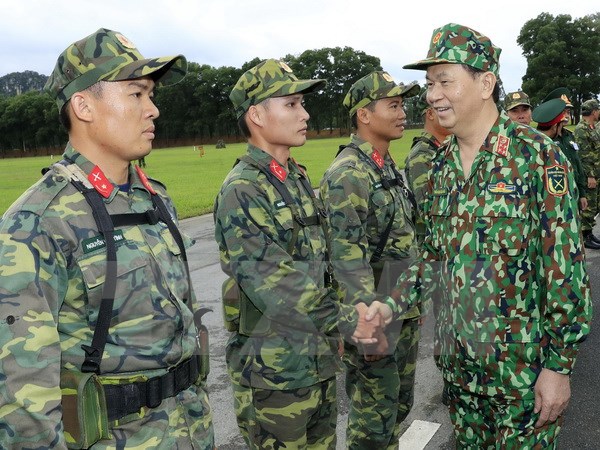 Chủ tịch nước Trần Đại Quang làm việc với Bộ Quốc phòng tại Trung tâm Huấn luyện Miếu Môn, Hà Nội. (Ảnh: Nhan Sáng/TTXVN)