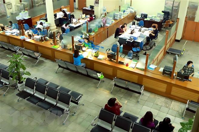 Hoạt động giao dịch thanh toán tại Kho bạc Nhà nước Hà Nội. (Ảnh minh họa: Hoàng Hùng/TTXVN)