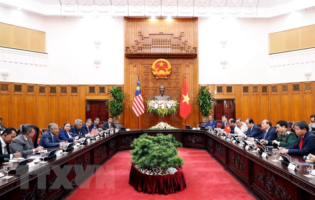 Thủ tướng Nguyễn Xuân Phúc hội đàm với Thủ tướng Malaysia Mahathir Mohamad. (Ảnh: Thống Nhất/TTXVN)
