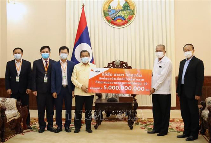 Cộng đồng người Việt tại Lào chung tay cùng chính quyền sở tại phòng chống COVID-19
